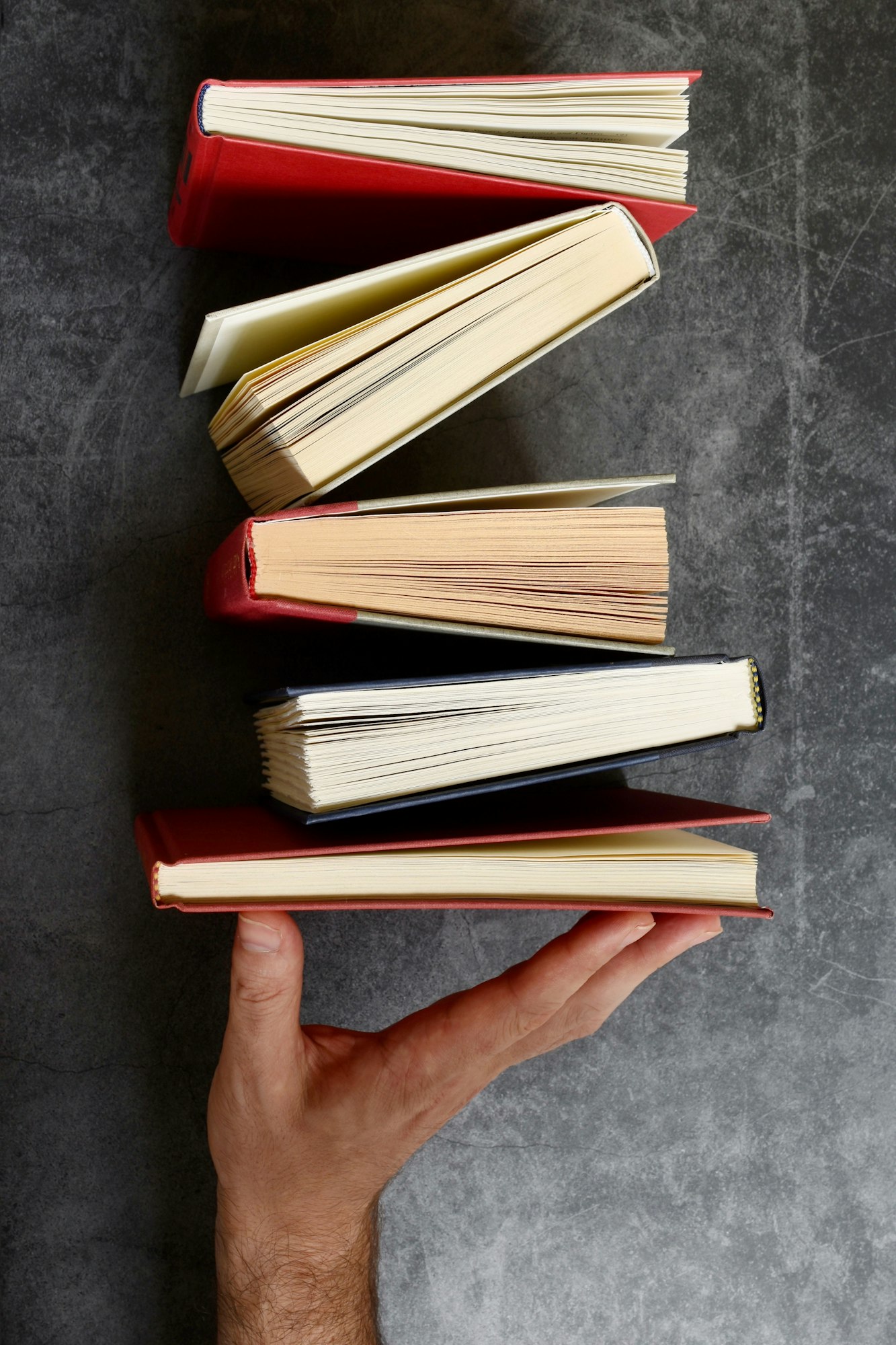 Hand holding books